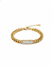 Gold chain bracelet with a rectangular stone on a white background